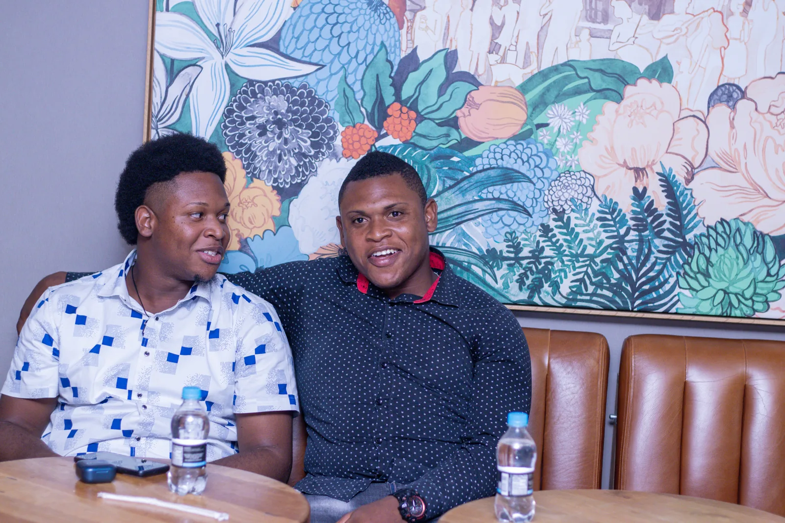 Two people seated together at the celebration